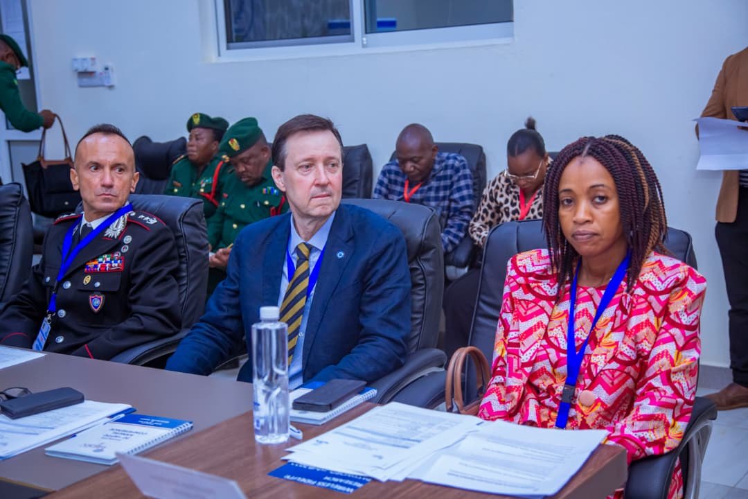 Delegates at the table — uniform, suit, and IAPTC notes