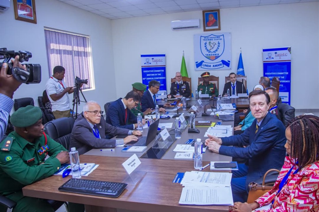 Executive committee around the table — military, police and civilian